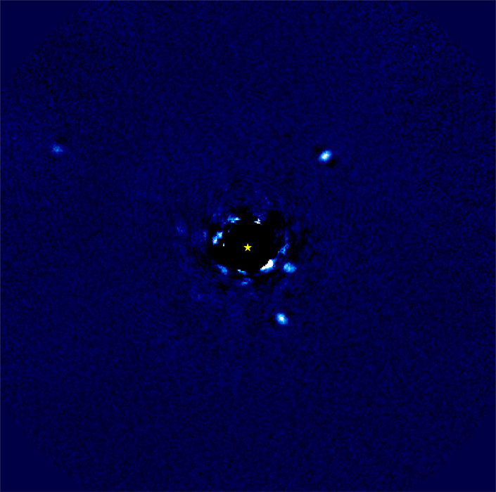 Four bright spots around a black disk have shifted