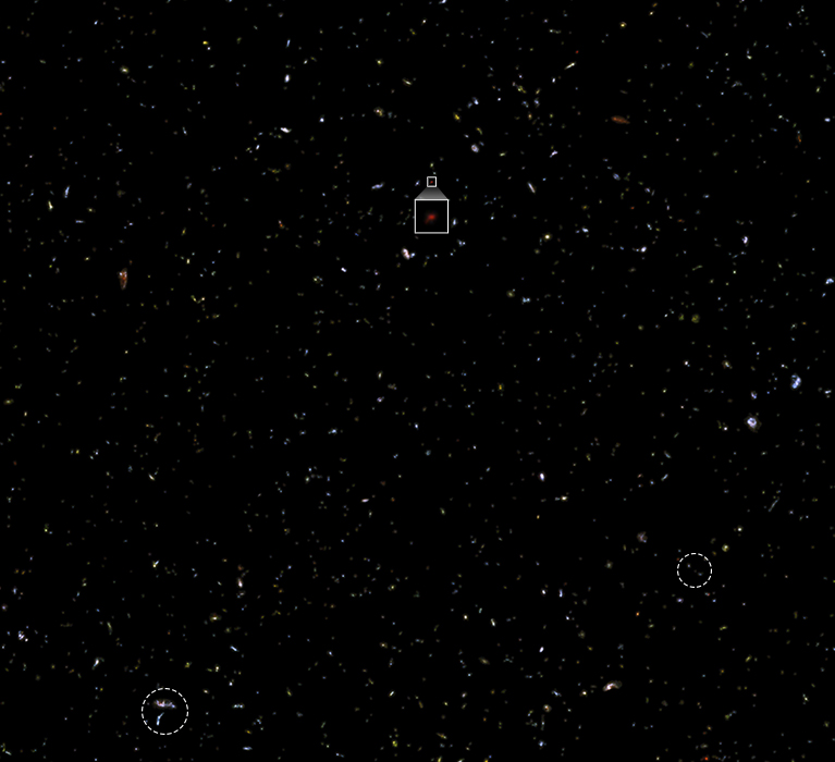Same field with many tiny, reddish galaxies
