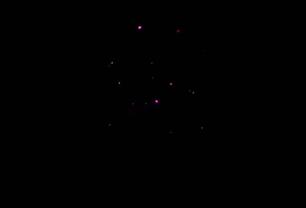 Scattered bright dots on a black background