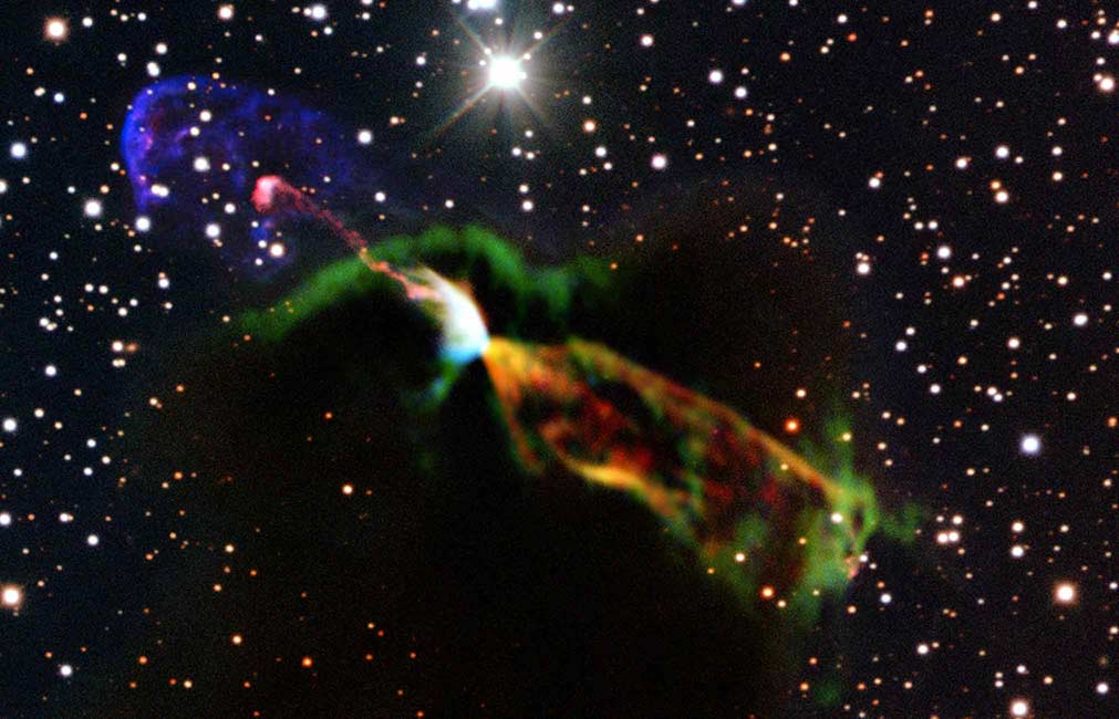 Many bright shapes overlay a dark cloud that hides stars