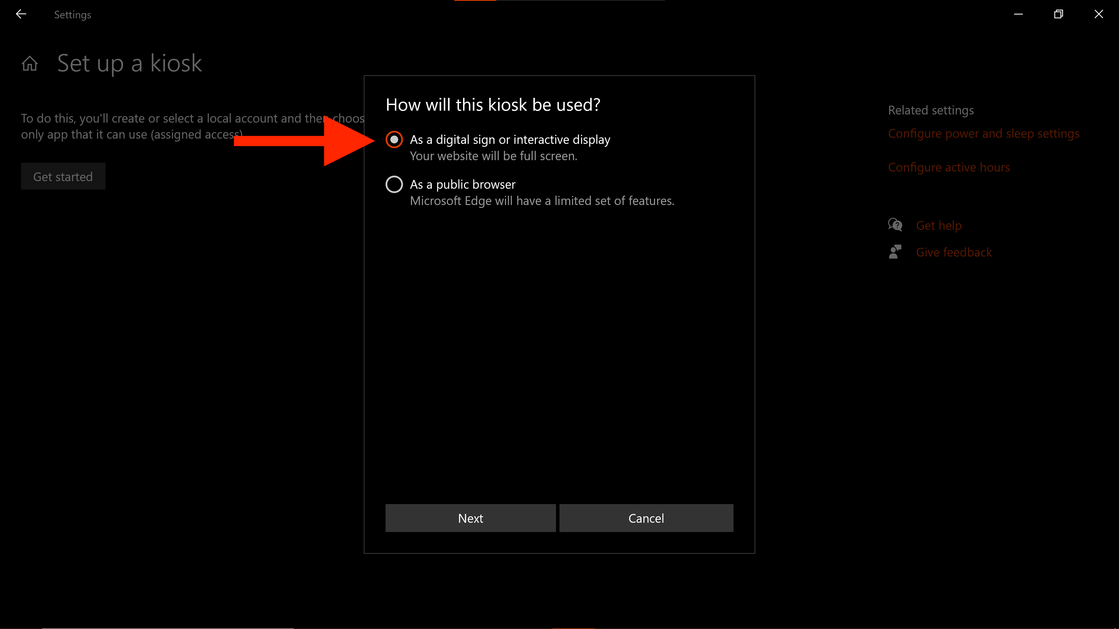Screenshot of a pop-up window that says “How will this kiosk be used?” Two options are listed below. A large red arrow points to the first option that reads “As a digital sign or interactive display.”