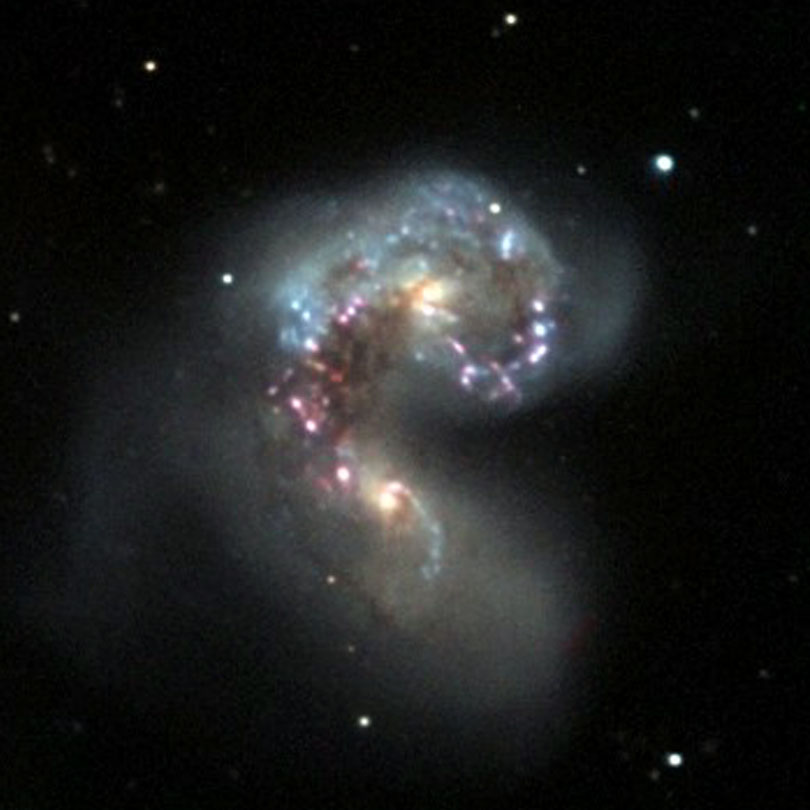 As each slider bar is manipulated, the view transitions from visible light to infrared light. In visible light: These two galaxies have been merging for 800 million years. In infrared light: The addition of infrared highlights dusty regions where stars are forming.
