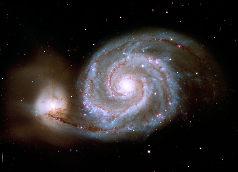 As each slider bar is manipulated, the view transitions from visible light to infrared light. In visible light: The Whirlpool Galaxy is a spiral interacting with a small companion. In infrared light: The dusty spokes in M51 are easily seen in infrared light.