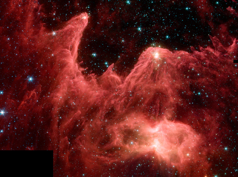 As each slider bar is manipulated, the view transitions from visible light to infrared light. In visible light: Bright, young stars light up the gas. In infrared light: Clusters of forming stars can be seen in the tips of massive dust pillars.