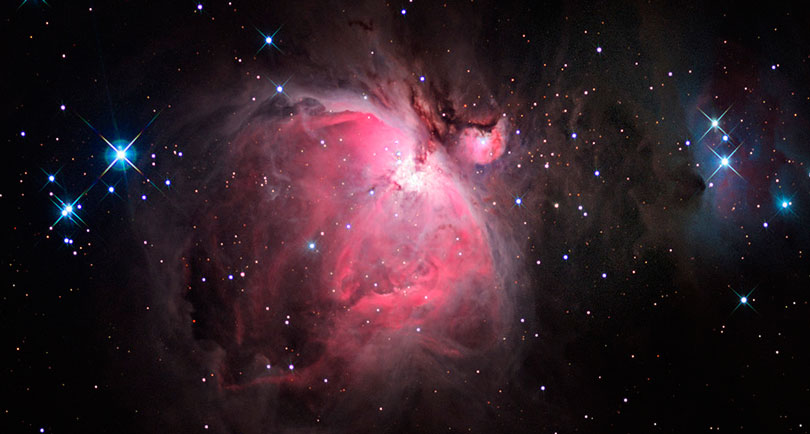 As each slider bar is manipulated, the view transitions from visible light to near infrared light to mid infrared light. In visible light: The Orion Nebula shines with the glow of hot gas. In near infrared light: Dust begins to glow in the infrared. In mid infrared light: Mid-infrared light shows the warm dust (red).