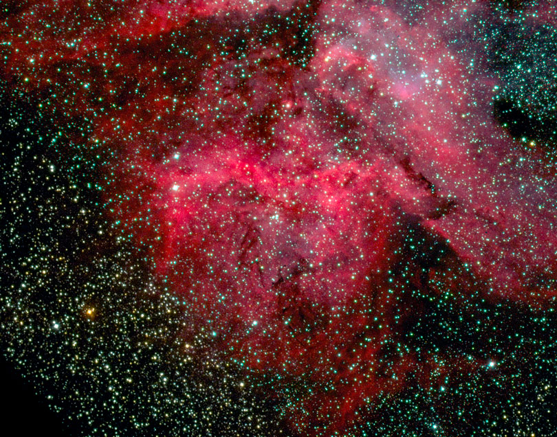 As each slider bar is manipulated, the view transitions from visible light to infrared light. In visible light: Dazzling light from the massive star Eta Carinae shapes these dust clouds. In infrared light: Pillars of dust that survive the devastating glow of Eta Carinae stand out in infrared light.