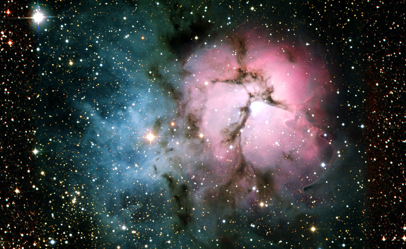 As each slider bar is manipulated, the view transitions from visible light to mid infrared light. In visible light: The Trifid Nebula glows in visible light. In mid infrared light: Deeper in the infrared, the warmest dust begins to glow red.
