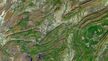 Satellite image of curving ridges and valleys