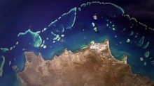 Satellite image of an island with a coral reef