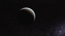 A planet in space. The top right of the planet faces a light, while the rest of it is covered in shadows.