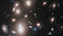 Many galaxies of different shapes, sizes, and colors.